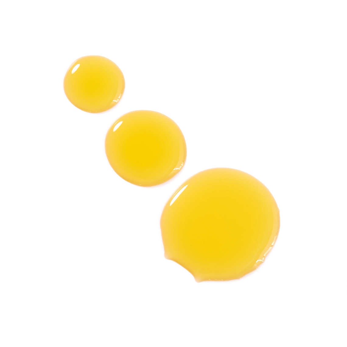 Photographie de texture d'une huile pour le corps de couleur jaune orange - Photographe cosmetiques - photographe texture cosmetiques - photographe produits cosmetiques - Aurore Aivrest