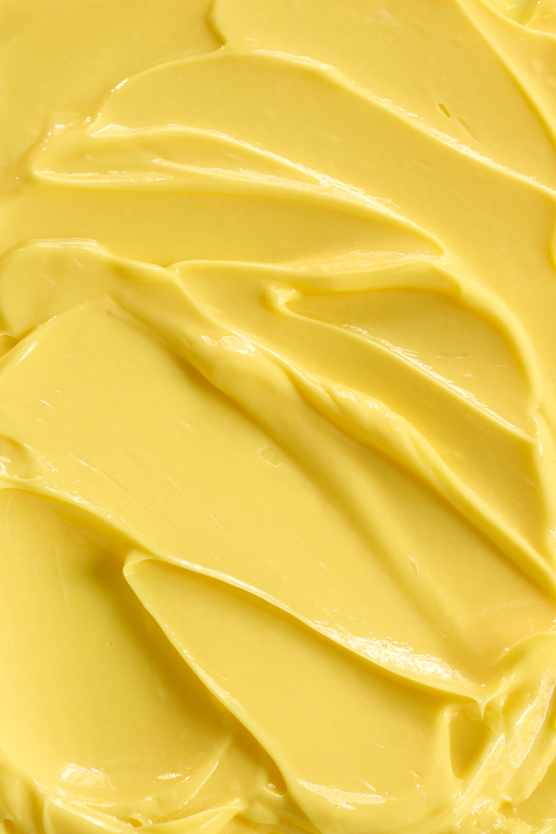 Photographie de texture d'une crème pour le corps de couleur jaune orange - Photographe cosmetiques - photographe texture cosmetiques - photographe produits cosmetiques - Aurore Aivrest