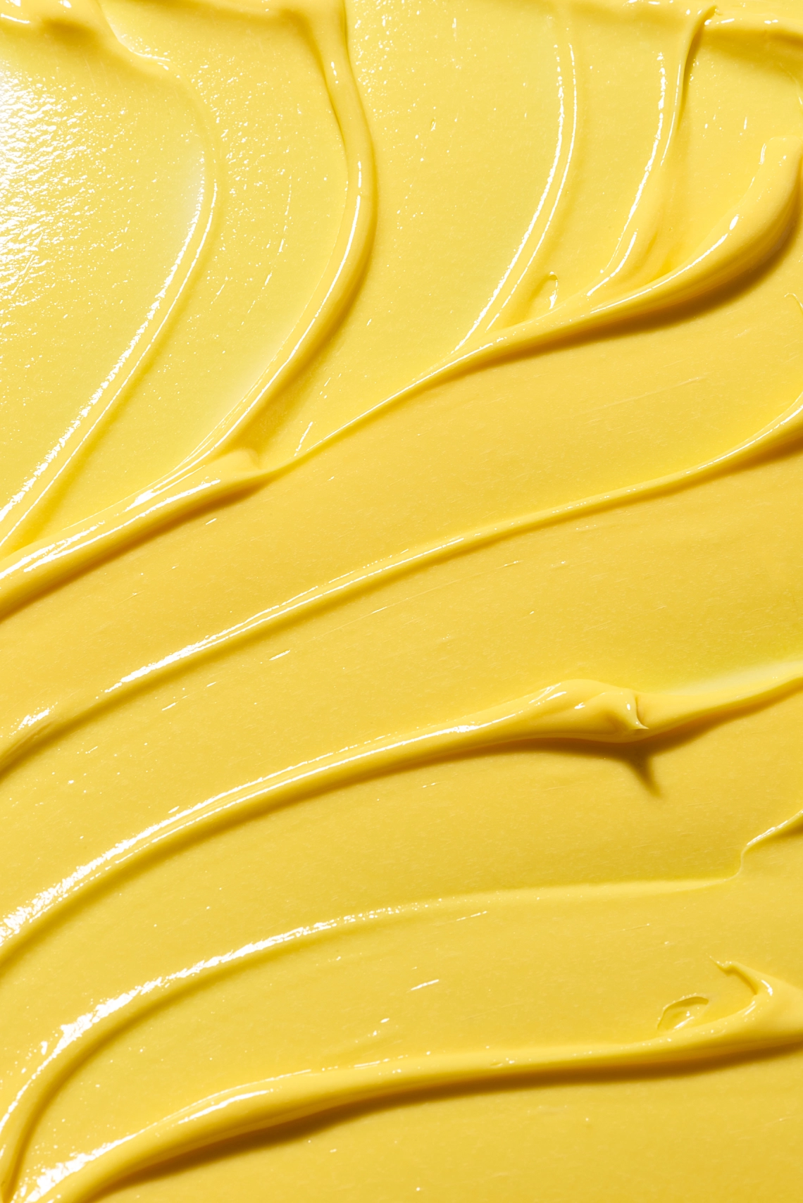 Photographie de texture d'une crème pour le corps de couleur jaune orange - Photographe cosmetiques - photographe texture cosmetiques - photographe produits cosmetiques - Aurore Aivrest